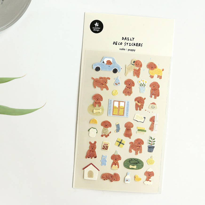 A sheet of decorative stickers featuring various cute dog designs and related items like a house, car, and notebook.