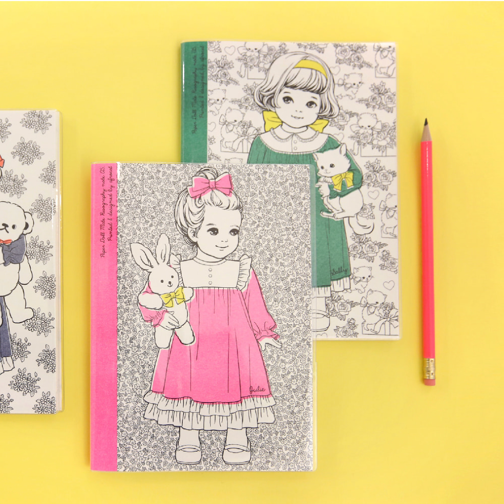 Coloring books with illustrations of a girl and her toys on a yellow background