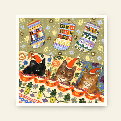 Illustration of three cats wearing Santa hats with Christmas stockings in the background.