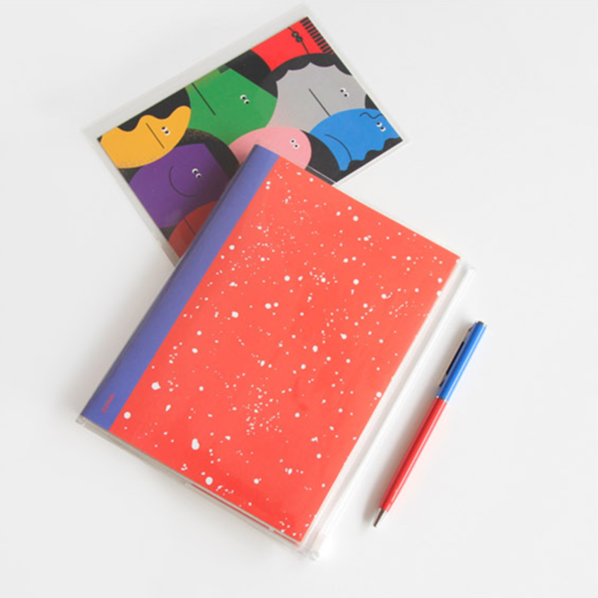 notebooks with colorful covers and a pen on a white background