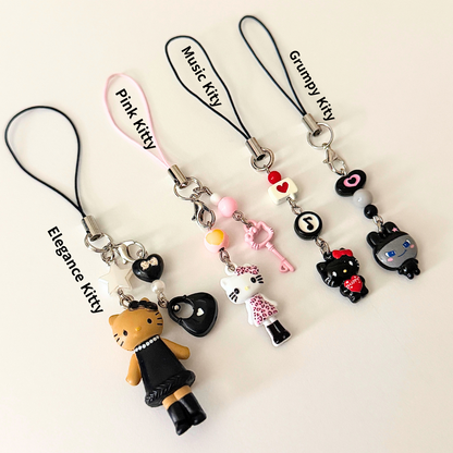 Set of five cat-themed keychains with name labels on a white background