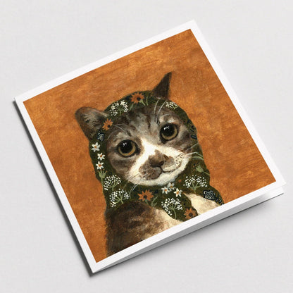 Notebook with a cat illustration on the cover against a white background