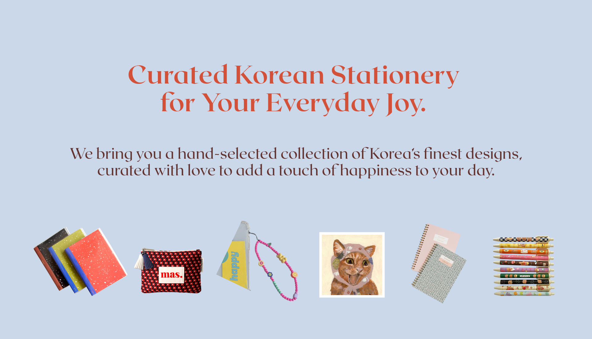 Promotional image for curated Korean stationery with products and a cat illustration on a light blue background.